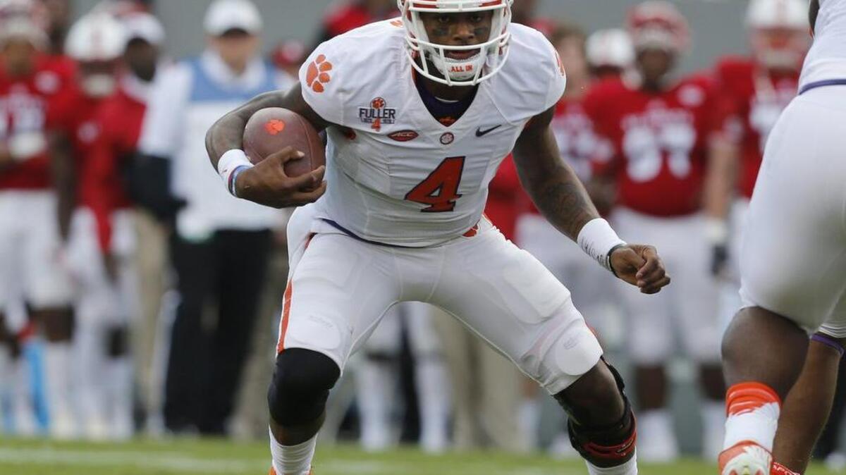 Clemson quarterback Deshaun Watson scrambles for yards during the first half against North Carolina State on Saturday.