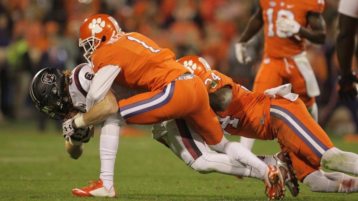 South Carolina Gamecocks tight end Hayden Hurst is brought down by Clemson Tigers cornerback Trayvon Mullen on a pass play in the first half at Memorial Stadium in Clemson, SC, Saturday, November 26, 2016.