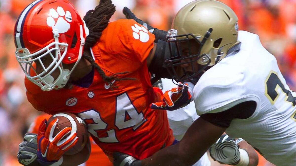 
Clemson Tigers running back Zac Brooks (24) carries the ball during the first half against the Wofford Terriers at Clemson Memorial Stadium.

