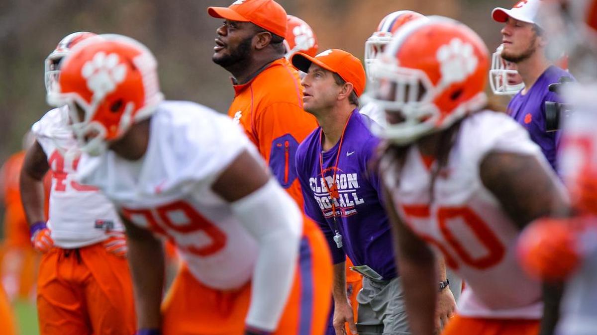 Clemson coach Dabo Swinney watches punt formation drills during the first day of spring football practice.