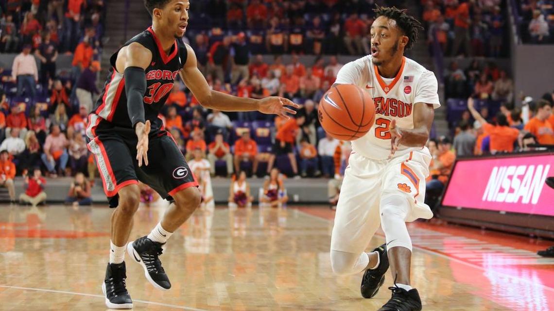 Clemson Tigers guard Marquise Reed (2) passes the ball as Georgia Bulldogs guard J.J. Frazier (30) defends Friday night at Littlejohn Coliseum.