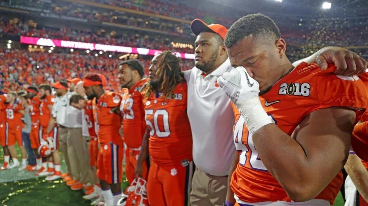 Clemson players gather in front of their fans after losing to Alabama in the national title game last year.