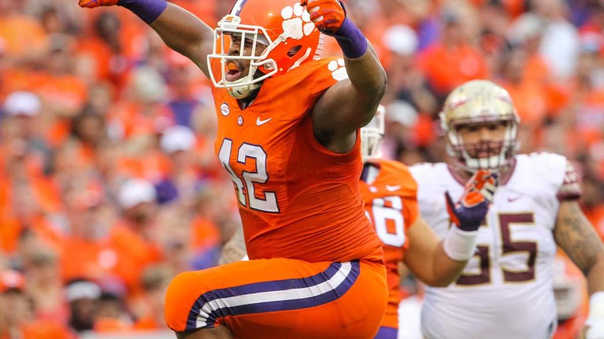 Clemson's defensive lineman Christian Wilkins (42) celebrates a stop during a game against Florida State. He is projected as a first-round pick.