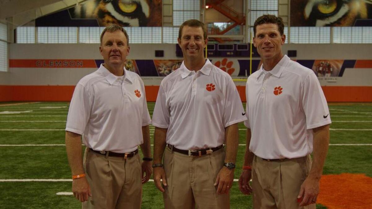 
Clemson coaches, (l-r) Chad Morris. Dabo Swinney, and Brent Venables are photographed during Media Day at Memorial Stadium.
