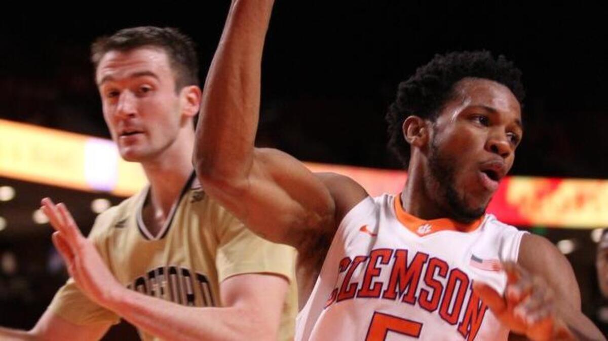 Clemson Tigers forward Jaron Blossomgame (5) controls the ball against Wofford.