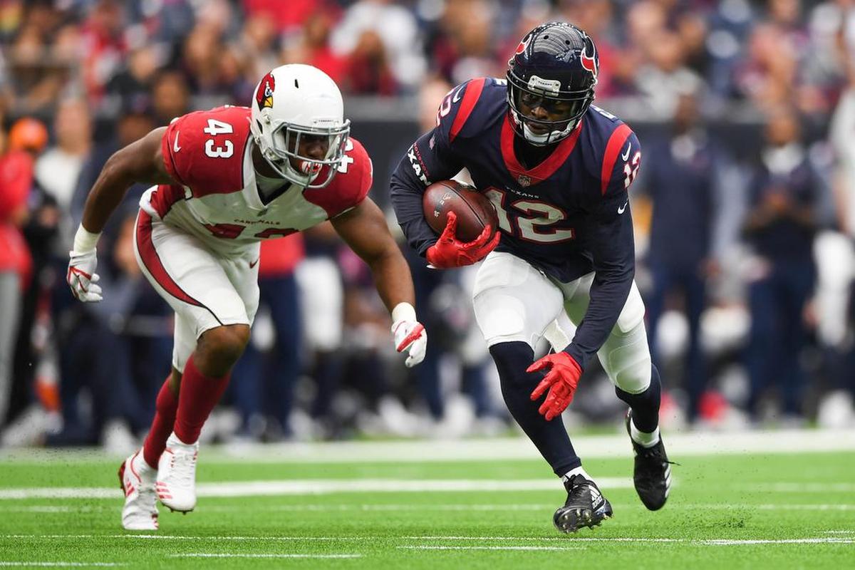 Houston Texans wide receiver Bruce Ellington (12) runs the ball as Arizona Cardinals inside linebacker Haason Reddick (43) defends during the second quarter at NRG Stadium.