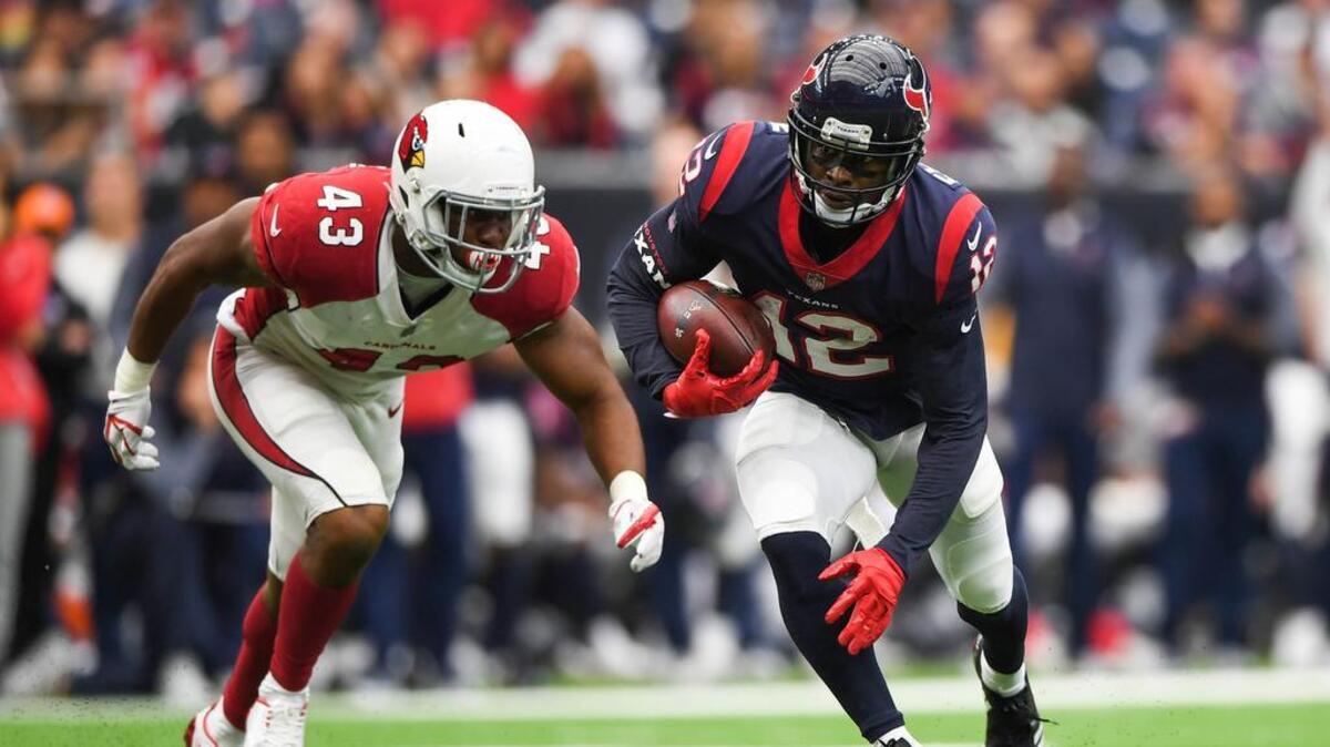 Houston Texans wide receiver Bruce Ellington (12) runs the ball as Arizona Cardinals inside linebacker Haason Reddick (43) defends during the second quarter at NRG Stadium.