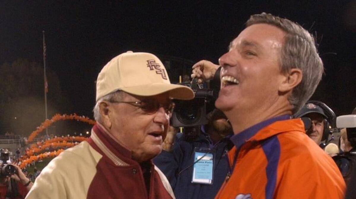 From 2003: Florida State head coach Bobby Bowden shakes the hand of his son and Clemson head coach Tommy Bowden before the Tigers take on the Seminoles in Clemson.