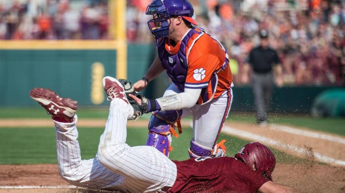 South Carolina shortstop Madison Stokes slides into home plate against Clemson catcher Chris Williams at Founders Park.