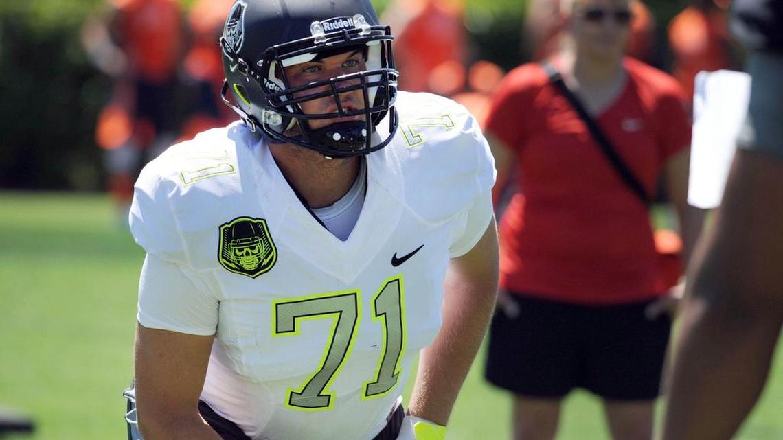 
Mitch Hyatt (71) gets set for some drills during Nike Football ' The Opening' in 2014
