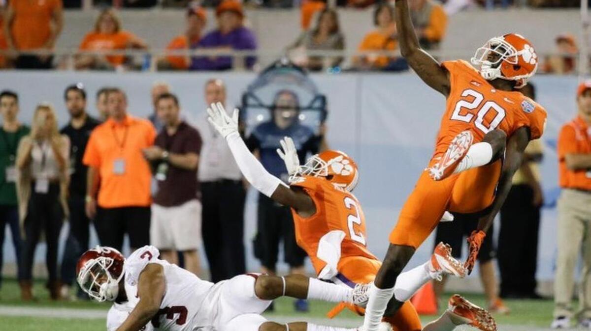 Clemson safety Jayron Kearse (20) and cornerback MacKensie Alexander (2) break up a pass intended for Oklahoma wide receiver Sterling Shepard (3) in 2014.