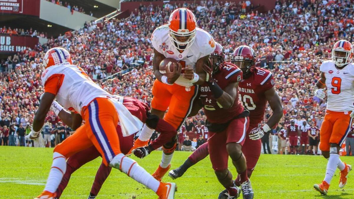 Clemson quarterback Deshaun Watson (4) scores his first of three touchdowns during the USC-Clemson game this past season.