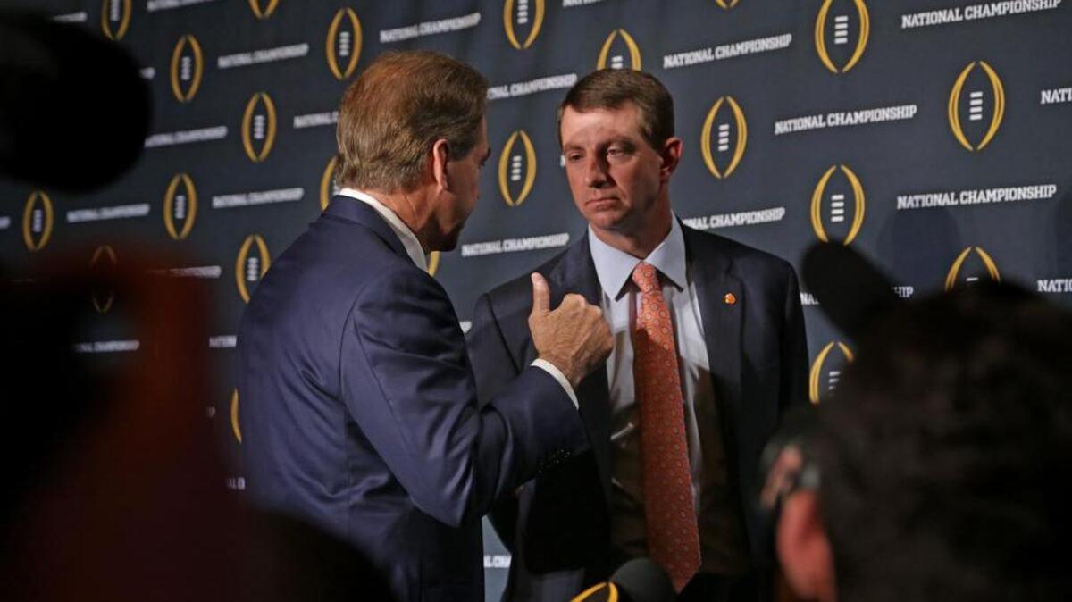 Clemson head coach Dabo Swinney and Alabama head coach Nick Saban talk Sunday after the head coaches press conference at the JW Marriott Camelback Inn.