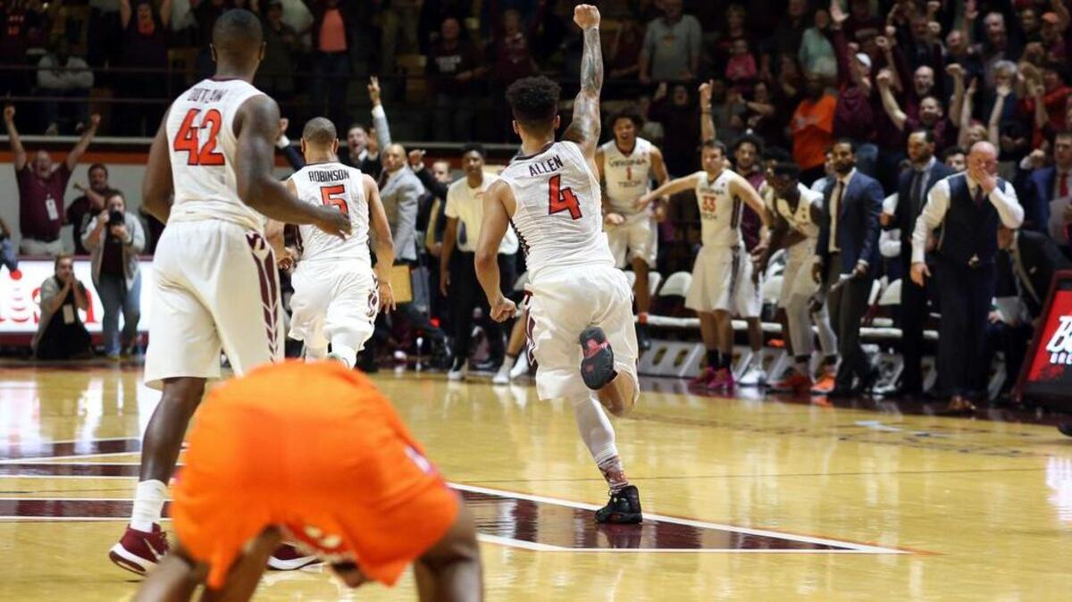 Virginia Tech’s Seth Allen (4) and teammates celebrate the team's 71-70 win over Clemson.