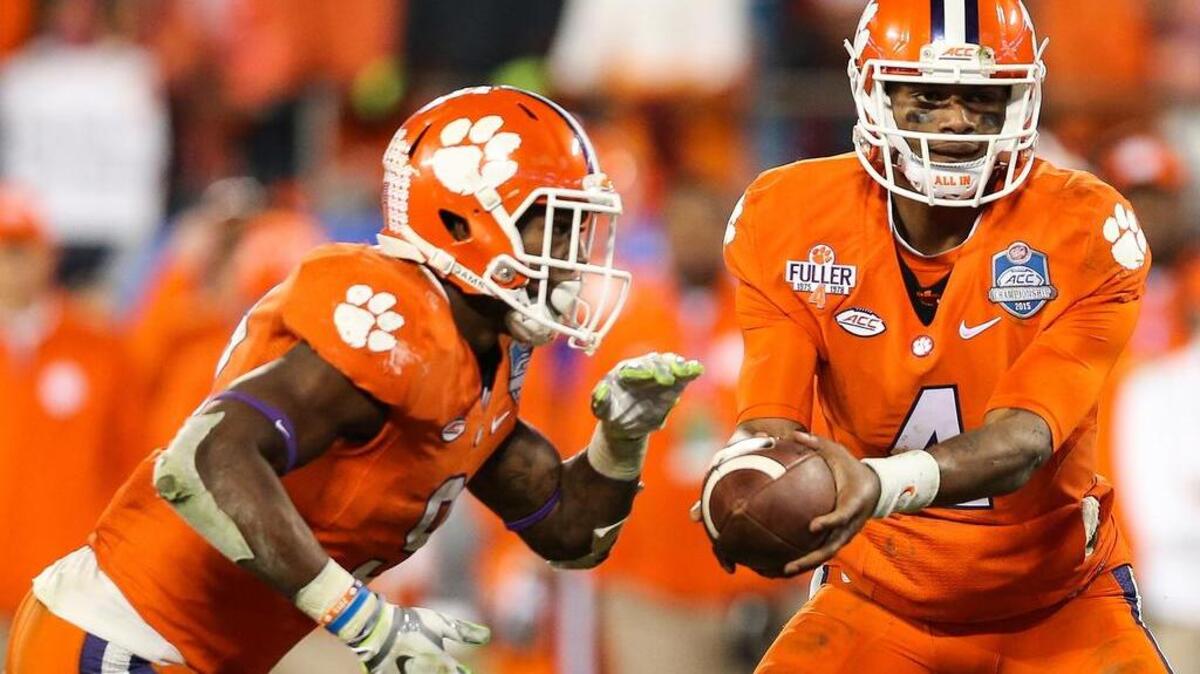 Clemson Tigers quarterback Deshaun Watson (4) hands off to running back Wayne Gallman (9)