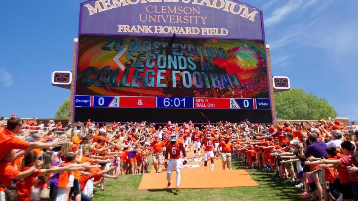 
Clemson Tigers players run onto the field prior to the Clemson spring game at Clemson Memorial Stadium. 
