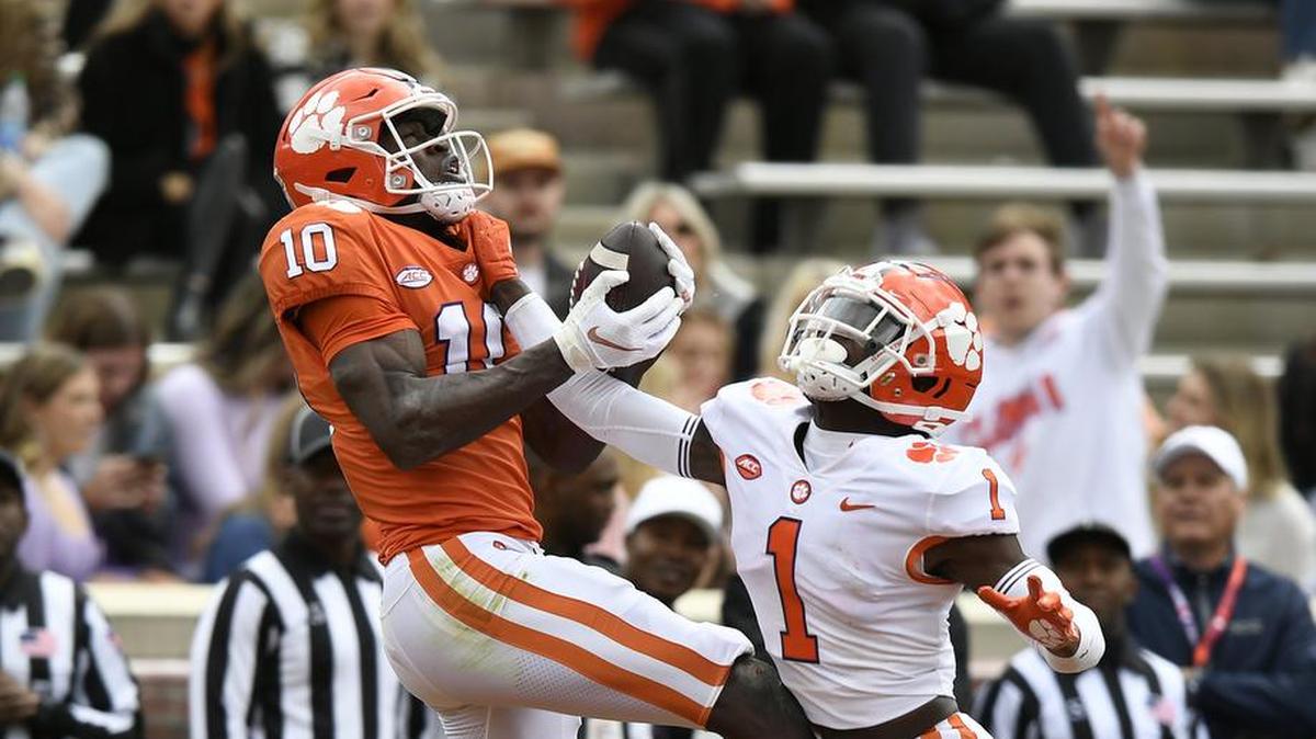 Clemson wide receiver Joseph Ngata (10) catches a touchdown over safety Andrew Mukuba (1) during the first half of the Tigers spring game Saturday, April 9, 2022 at Clemson’s Memorial Stadium. The play was called back after head coach Dabo Swinney signaled that QB quarterback DJ Uiagalelei (5) had been sacked on the play. Bart Boatwright/Special to The State