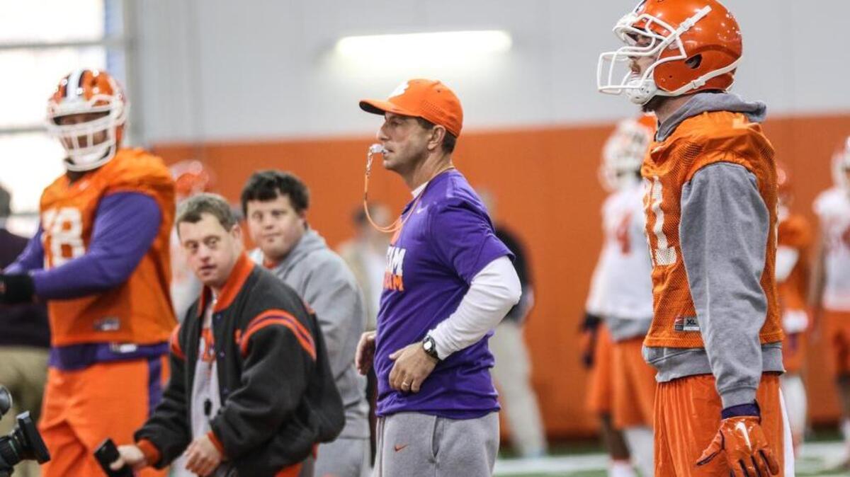 Clemson's Dabo Swinney takes the practice field at Clemson during a tuesday practice for the National Championship game.
