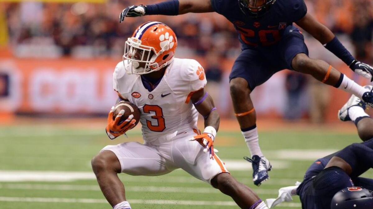 Nov 14, 2015; Syracuse, NY, USA; Clemson Tigers wide receiver Artavis Scott (3) runs down field after making a catch while Syracuse Orange cornerback Cordell Hudson (20) pursues during the first quarter of a game at the Carrier Dome. Mandatory Credit: Mark Konezny-USA TODAY Sports