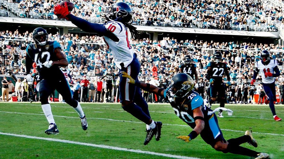 Houston Texans wide receiver DeAndre Hopkins (10) makes a touchdown catch between Jacksonville Jaguars strong safety Barry Church (42) and cornerback Jalen Ramsey (20) during the second quarter at EverBank Field.