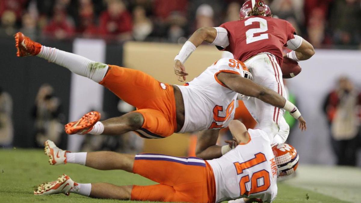 Alabama Crimson Tide quarterback Jalen Hurts (2) is brought down by Clemson Tigers safety Tanner Muse (19) in the second half of the National Championship in Tampa in January.