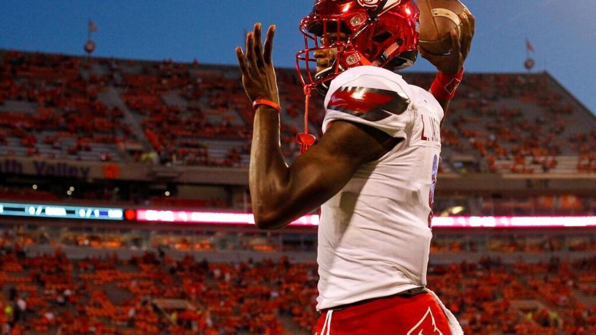 Heisman winner Lamar Jackson warms up prior to last year’s game against Clemson.