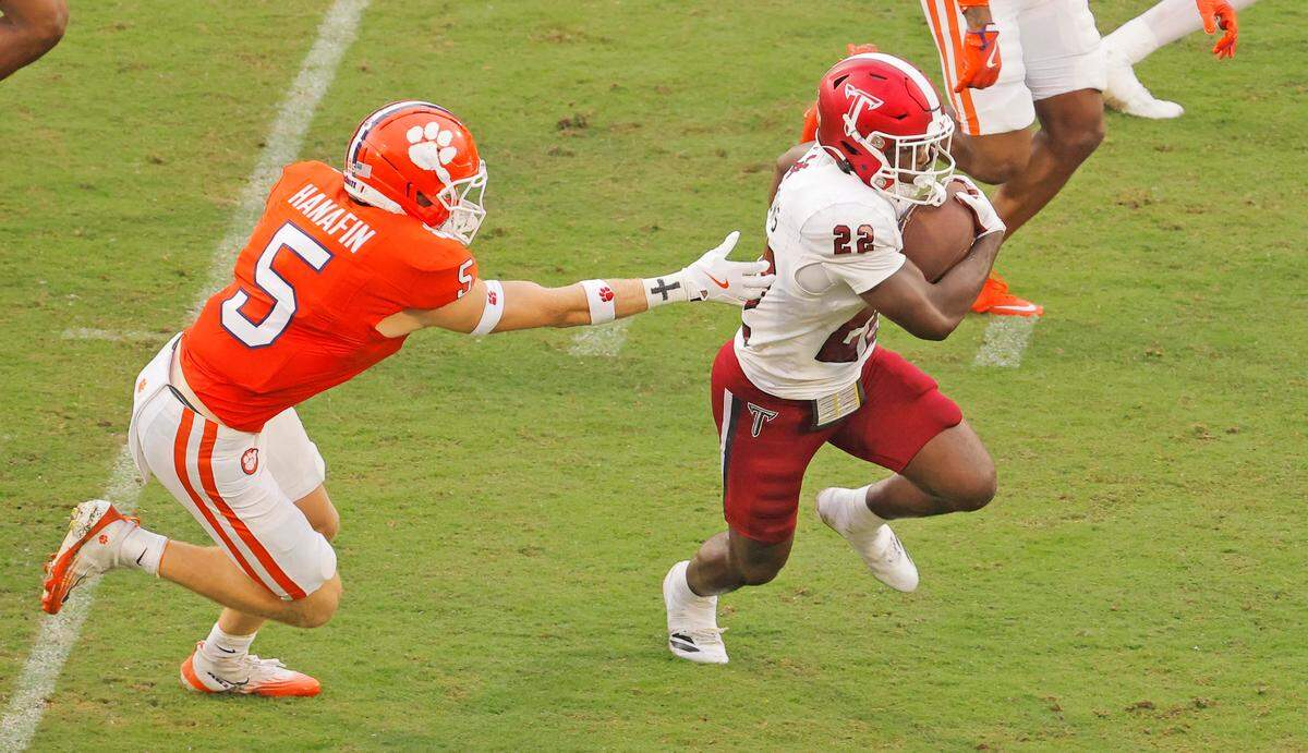 Troy running back Tae Meadows (22) escapes Clemson defensive back Ronan Hanafin (5) for a big gain during first-half action in Clemson, S.C on Saturday, Sept. 6, 2025.