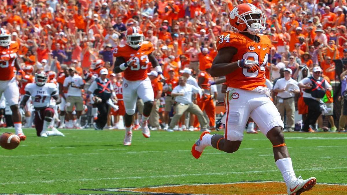 Clemson wide receiver Ray-Ray McCloud (34) lets the ball go before crossing the goal line during of the first half of their game against Troy at Memorial Stadium in Clemson.