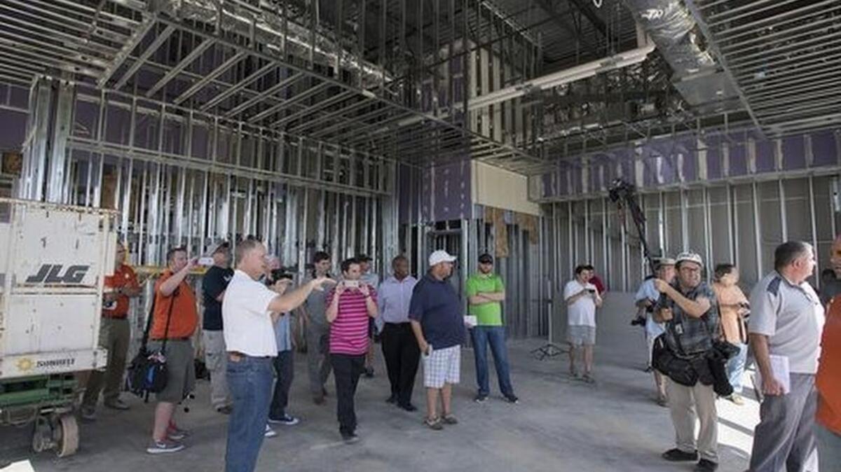 Clemson director of recruiting & external affairs Thad Turnipseed leads a group of the media on a tour of Clemson’s new football facility on Saturday, August 13, 2016.