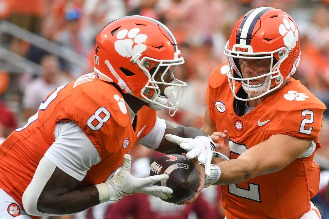 Clemson Tigers quarterback Cade Klubnik (2) hands the ball off to Clemson Tigers running back Adam Randall (8) Saturday, Sept. 6, 2025 during the NCAA football game against the Troy Trojans at Memorial Stadium in Clemson, South Carolina.