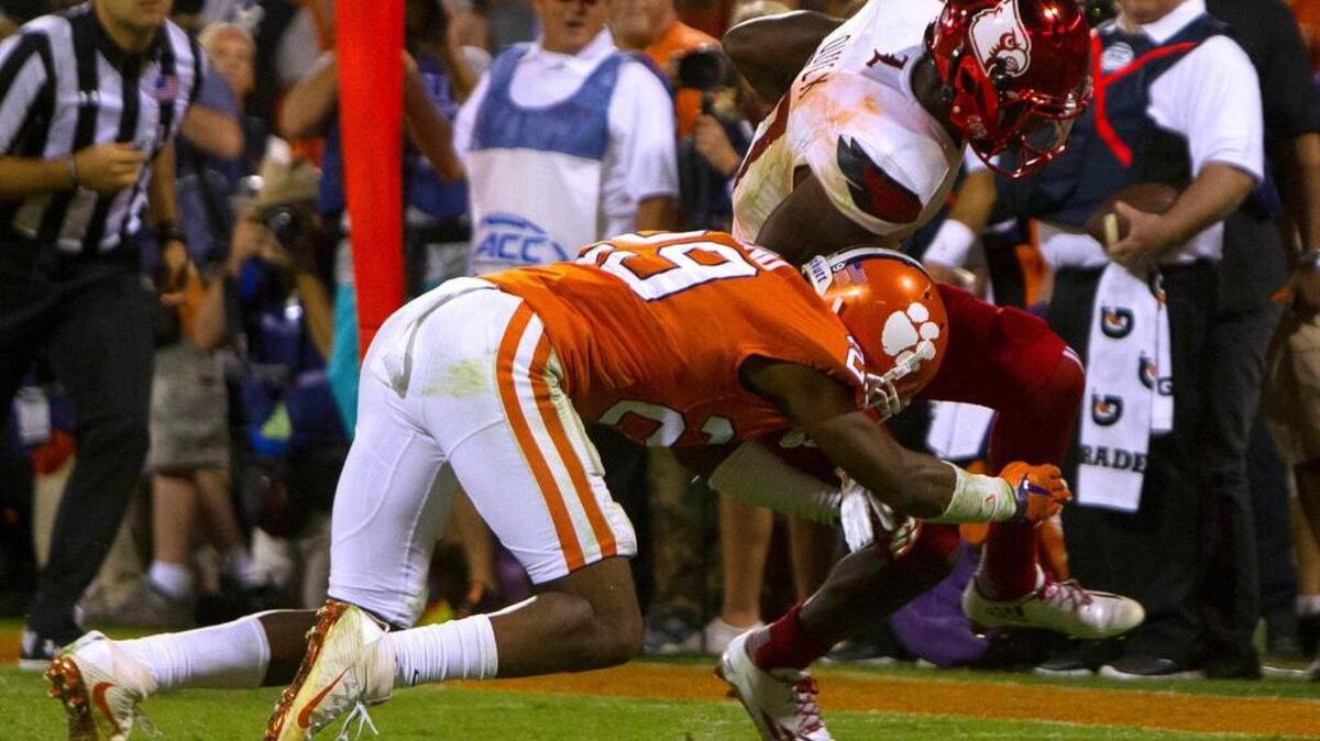 Clemson cornerback Marcus Edmond knocks Louisville receiver James Quick out of bounds on fourth down, clinching a win for the Tigers.