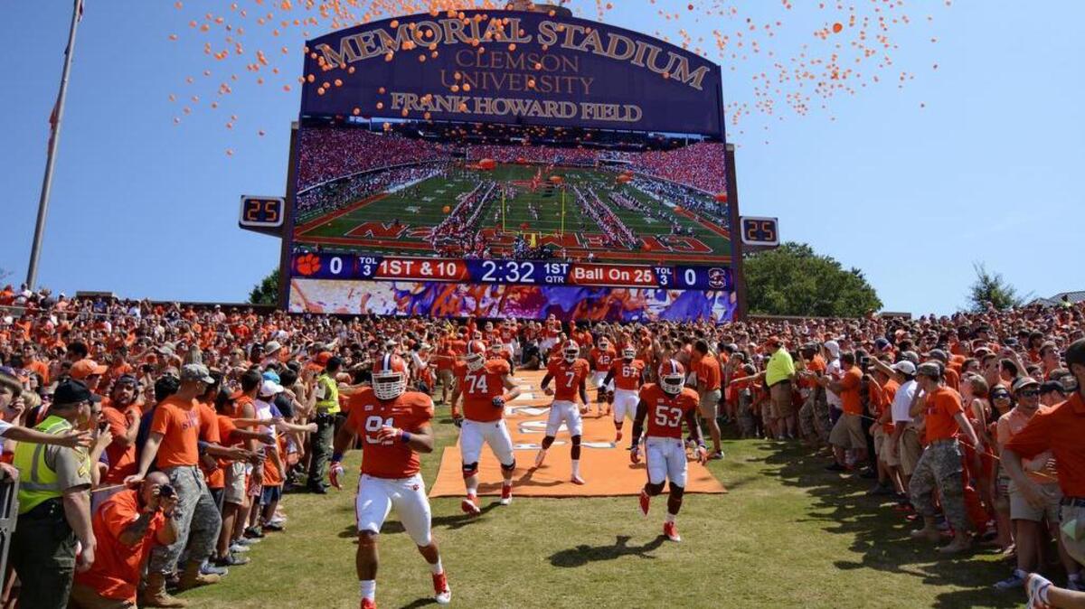 
Clemson players run down the hill before the start of a game against South Carolina State in 2013 at Memorial Stadium.
