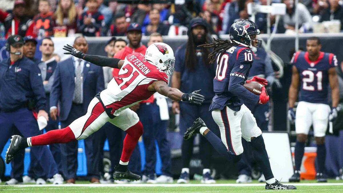 Houston Texans wide receiver DeAndre Hopkins (10) runs with the ball as Arizona Cardinals cornerback Patrick Peterson (21) defends during the third quarter at NRG Stadium.