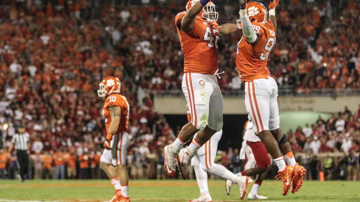 Clemson defensive linemen Christian Wilkins, left, and Clelin Ferrell celebrate a sack in the first quarter against Louisville last week. Wilkins will be playing in his home state for the first time at Boston College on Friday night.