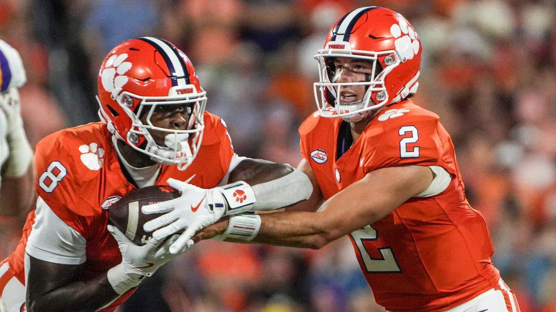 Clemson running back Adam Randall (8) takes the handoff from quarterback Cade Klubnik (2) playing LSU during the first quarter at Memorial Stadium in Clemson, S.C. Saturday, August 30, 2025.