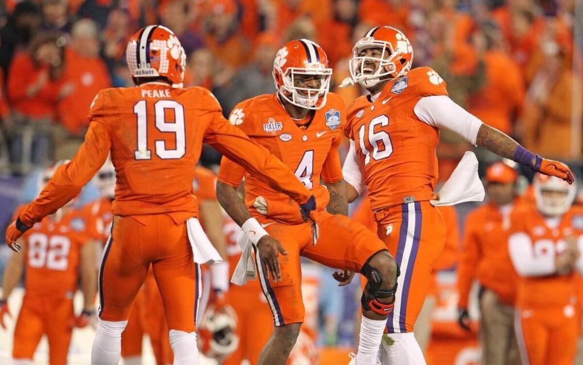 Clemson tight end Jordan Leggett (16) celebrates his touchdown with quarterback Deshaun Watson (4) and wide receiver Charone Peake in the second quarter of the ACC Championship game against North Carolina at Bank of America Stadium in Charlotte on Saturday.