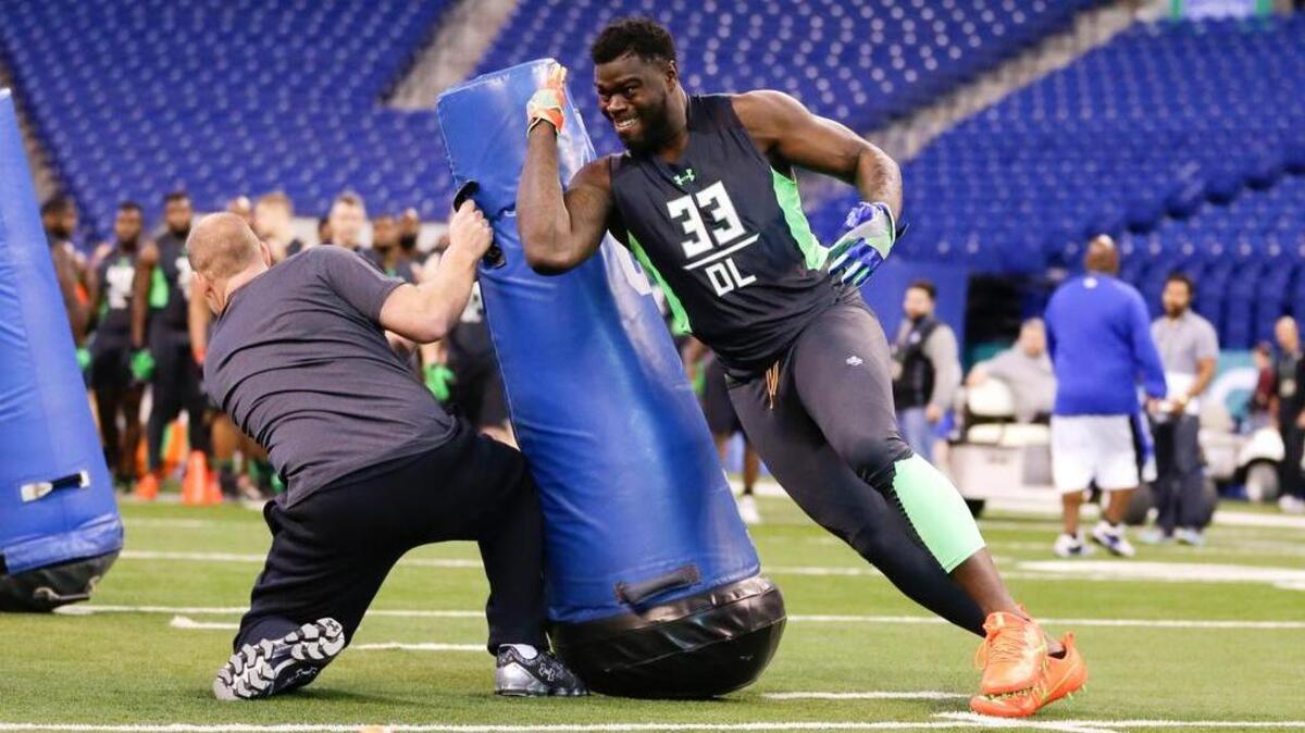 Clemson defensive lineman Shaq Lawson runs a drill at the NFL football scouting combine in Indianapolis, Sunday, Feb. 28, 2016. (AP Photo/Michael Conroy)