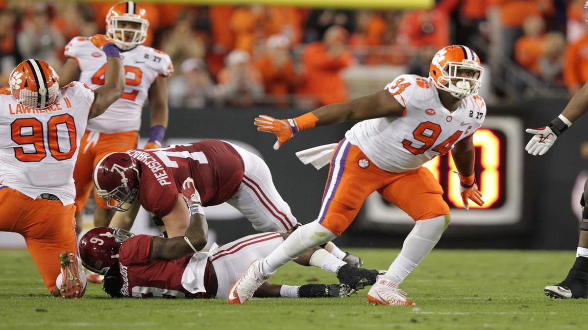 Clemson Tigers defensive tackle Carlos Watkins (94) celebrate a stop on Alabama Crimson Tide running back Bo Scarbrough (9).