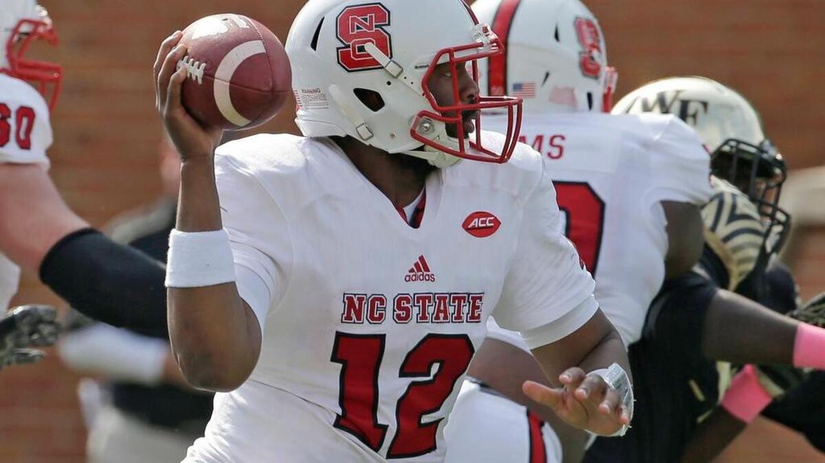 North Carolina State's Jacoby Brissett (12) looks to pass against Wake Forest in the second half of an NCAA college football game in Winston-Salem, N.C., Saturday, Oct. 24, 2015. North Carolina State won 35-17. (AP Photo/Chuck Burton)