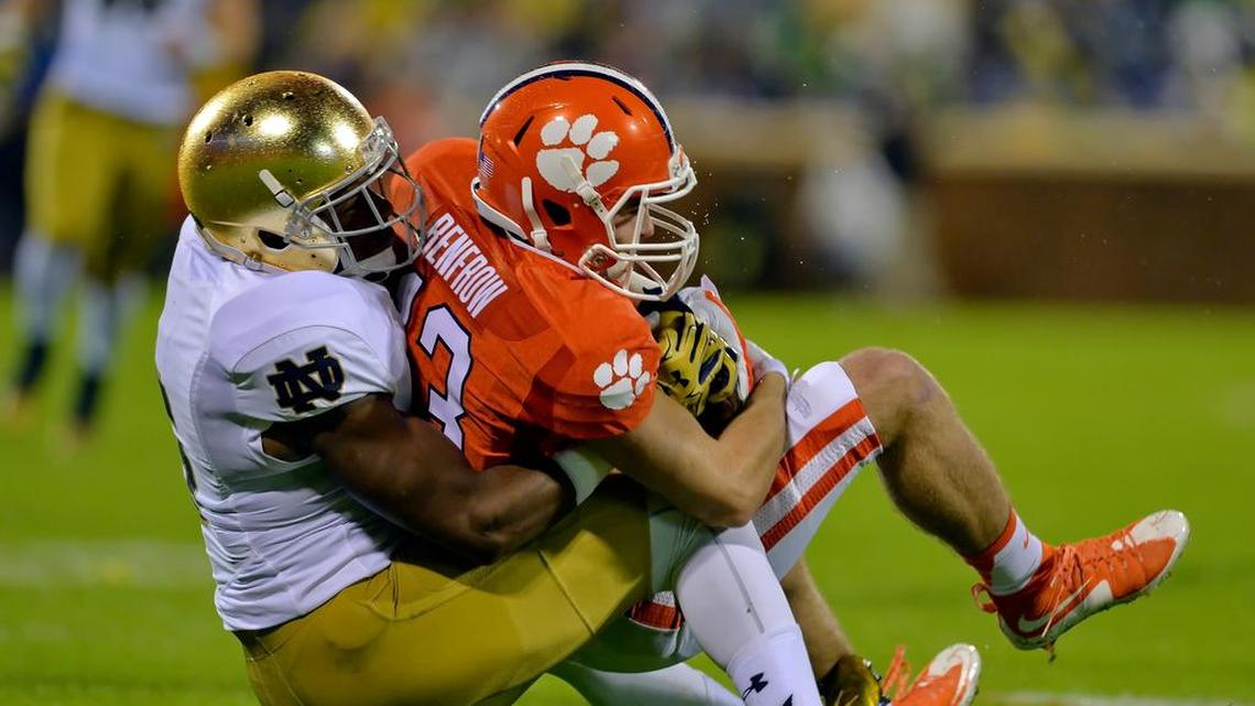 
Clemson’s Hunter Renfrow is tackled by Notre Dame’s KeiVarae Russell during the first half in an Oct. 3 game in Clemson, S.C.
