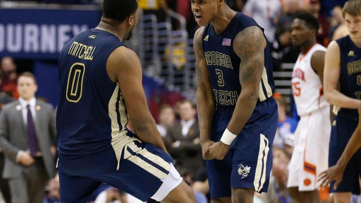 Georgia Tech forward Charles Mitchell celebrates with Marcus Georges-Hunt during the Yellow Jackets’ 88-85 overtime win over Clemson.