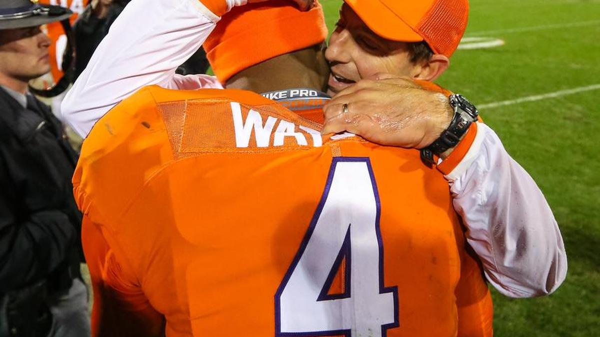 Clemson coach Dabo Swinney hugs quarterback Deshaun Watson after the Tigers defeated South Carolina 56-7 on Saturday.
