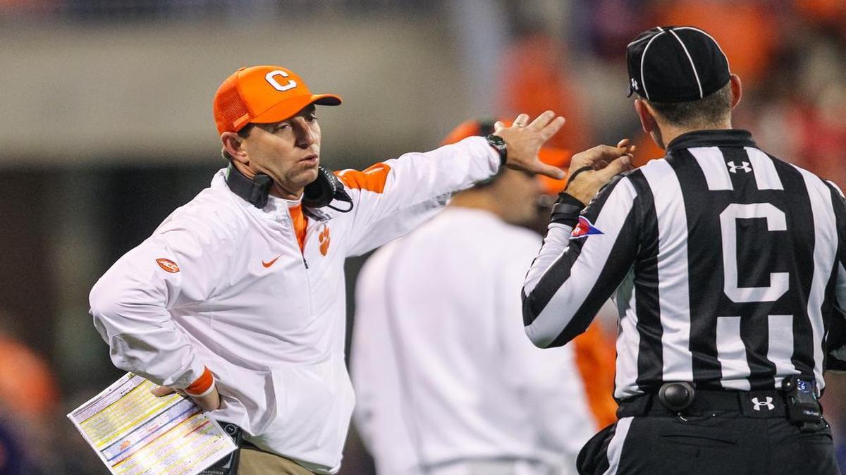 Clemson head coach Dabo Swinney discusses a call during the Tigers’ game against South Carolina on Saturday.