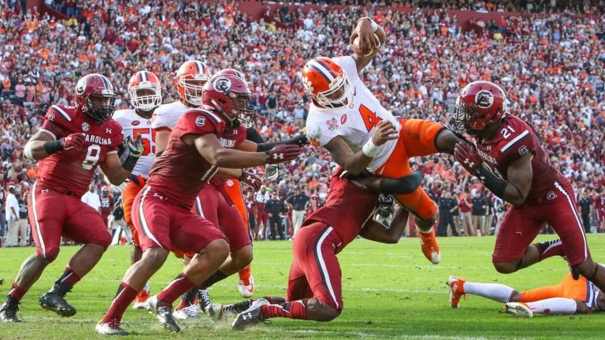 Clemson quarterback Deshaun Watson (4) scores one of his three touchdowns during the USC-Clemson game Saturday at Williams-Brice Stadium.