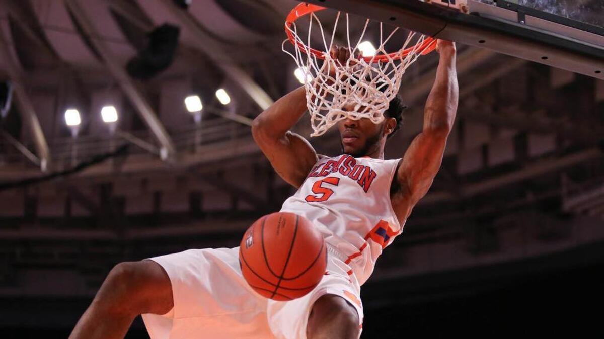 Clemson Tigers forward Jaron Blossomgame (5) dunks the ball against the Boston College Eagles during the first half at Bon Secours Wellness Arena.