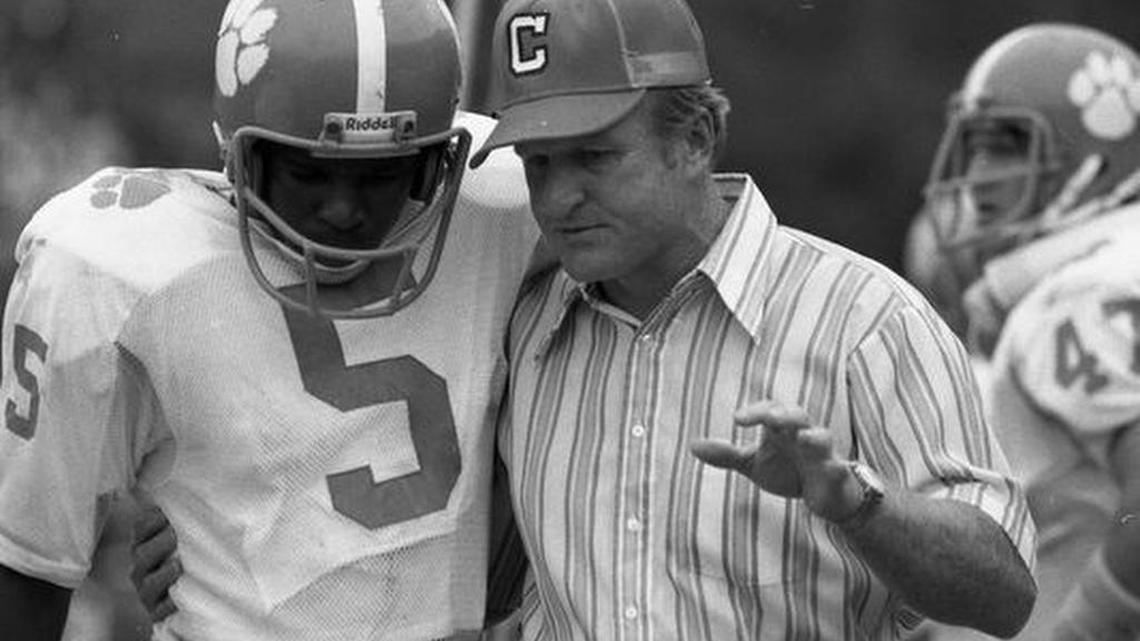 Clemson head coach Red Parker talks with his quarterback Willie Jordan (5) as the Tigers played Georgia Saturday October 4, 1975 at Georgia's Sanford Stadium in Athens, Ga. The Bulldogs defeated the Tiger 35-7.