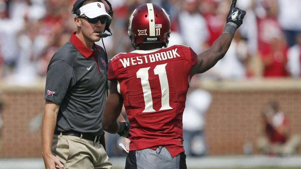 Lincoln Riley, Oklahoma’s offensive coordinator, left, talks with wide receiver Dede Westbrook during a Sooners victory earlier this year.