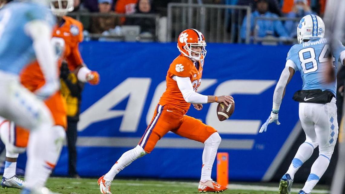 Clemson punter Andy Teasdale tries to pass on a fourth down in the first half of the ACC Championship game.