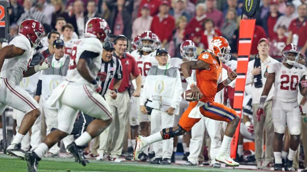 Clemson Tigers quarterback Deshaun Watson (4) gets a first down on a run in the second half of the National Championship game at University of Phoenix Stadium in Glendale, AZ, Monday, January 11, 2016.