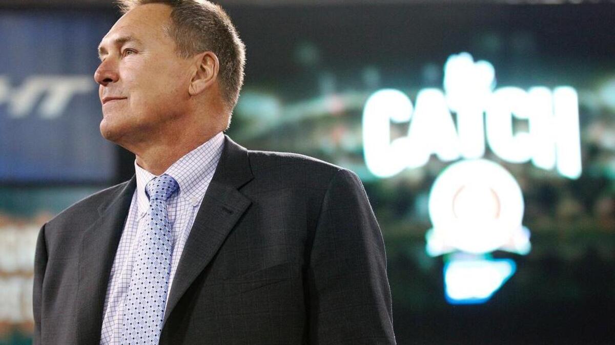 In this Dec. 23, 2013, file photo, former San Francisco 49ers wide receiver Dwight Clark is honored at halftime of an NFL football game between the 49ers and the Atlanta Falcons in San Francisco. Clark stands near the spot where he made a catch so famous it is referred to as "The Catch." Clark says he has Lou Gehrig’s disease and suspects playing football might have caused the illness. Clark announced Sunday, March 19, 2017. on Twitter that he has amyotrophic lateral sclerosis, a disease that attacks cells that control muscles. Clark linked to a post on his personal blog detailing his ALS diagnosis, but the site crashed Sunday night, apparently from an overflow of traffic.